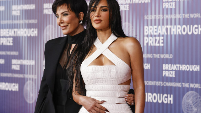 Kim Kardashian Stuns in White Leather Gown with Seductive Cutouts